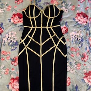 This is a black with gold lining midi dress. Worn only once for my birthday.